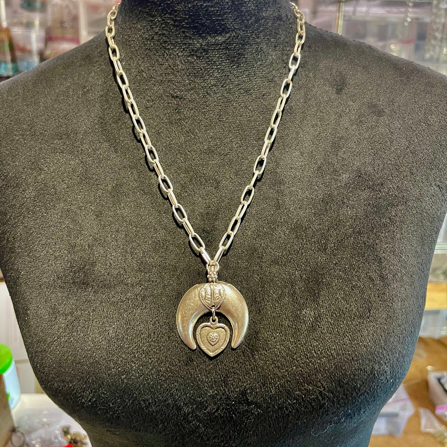 Silver Plate. Crescent Moon Pendant. The inverted moon is primarily a symbol of protection