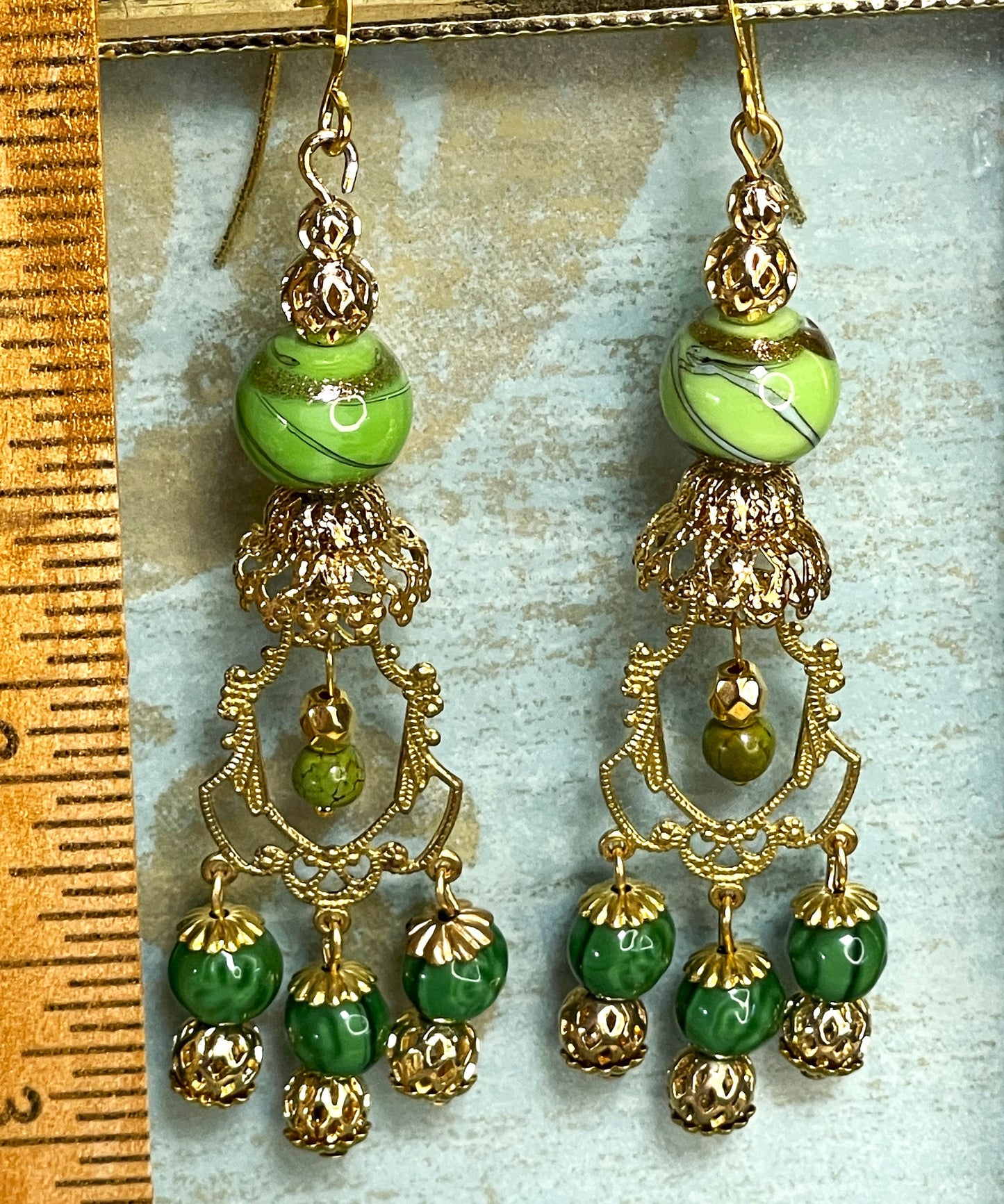 Vintage Drop Chandelier Earrings with Green and Gold Swirl Beads. Gold Brass Metal. Hypoallergenic French Earring Hooks, Gold Plated Wire.
