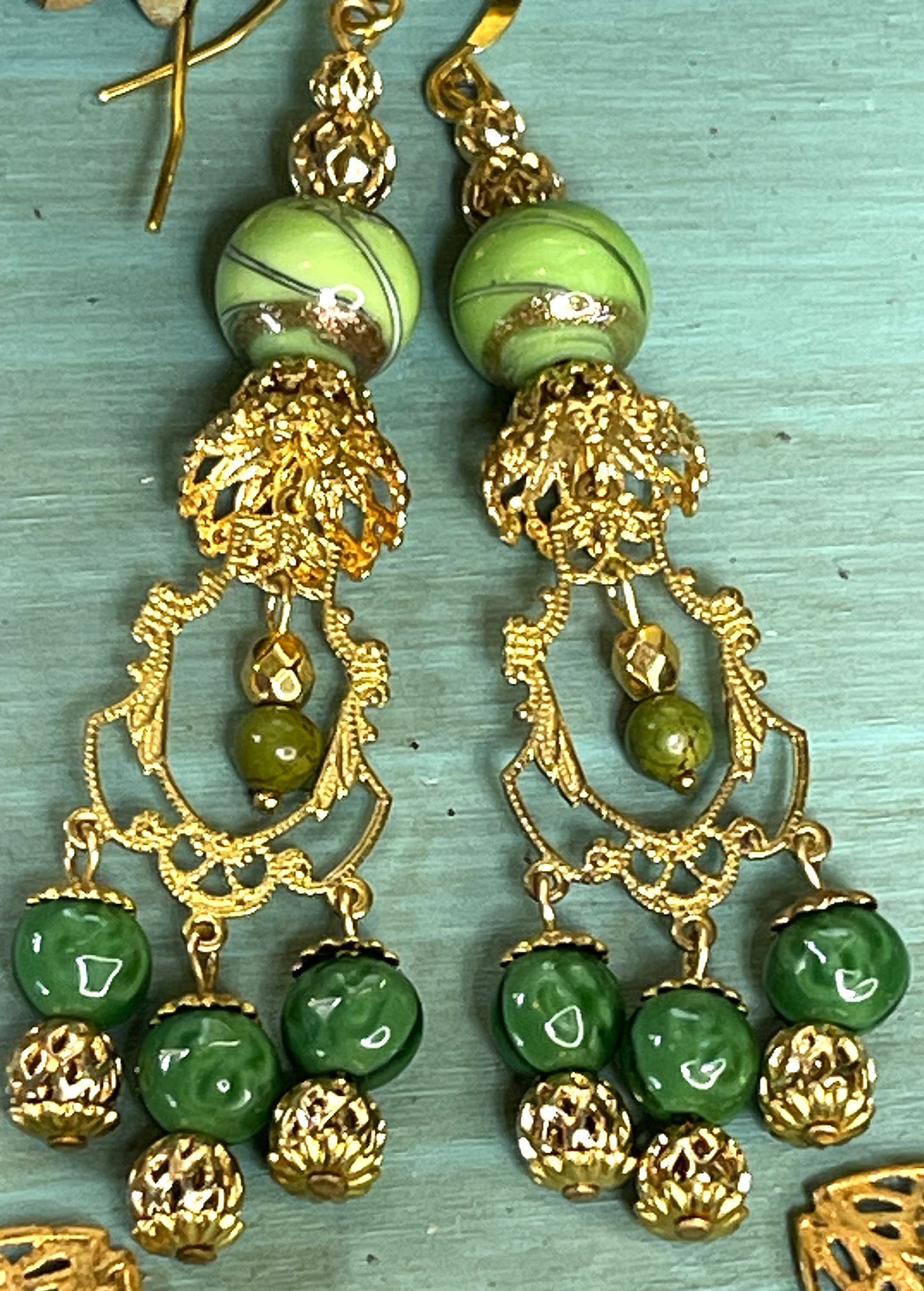 Vintage Drop Chandelier Earrings with Green and Gold Swirl Beads. Gold Brass Metal. Hypoallergenic French Earring Hooks, Gold Plated Wire.