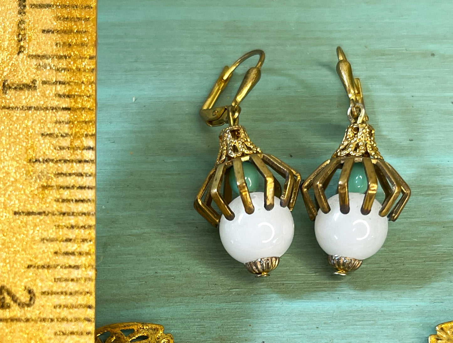 White and Sea Green Glass Beads, Caged in Brass. Earrings. Hypoallergenic French Earring Hooks, Gold Plated Wire.