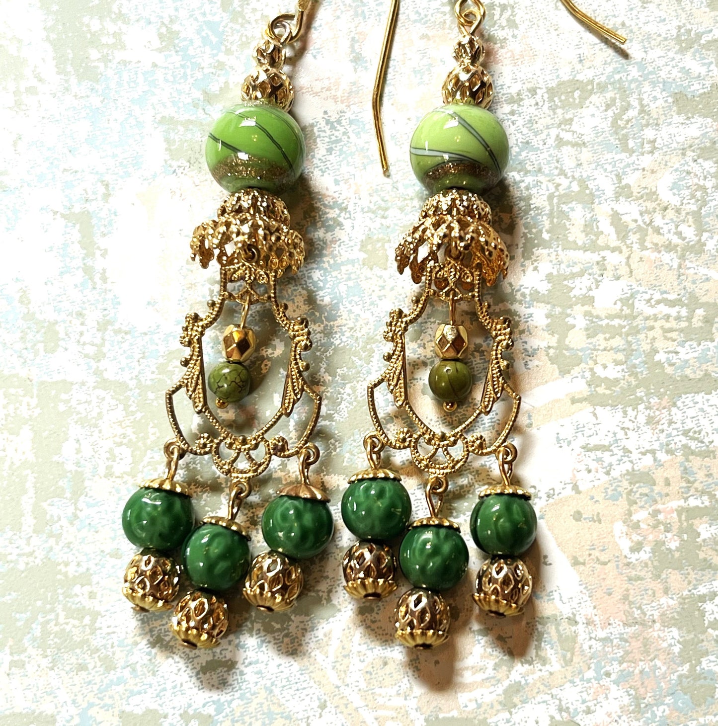 Vintage Drop Chandelier Earrings with Green and Gold Swirl Beads. Gold Brass Metal. Hypoallergenic French Earring Hooks, Gold Plated Wire.