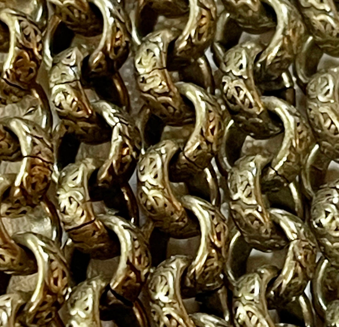 This Lovely Antique Brass Heavy Textured Chain is 6.3mm. Sold by the foot.