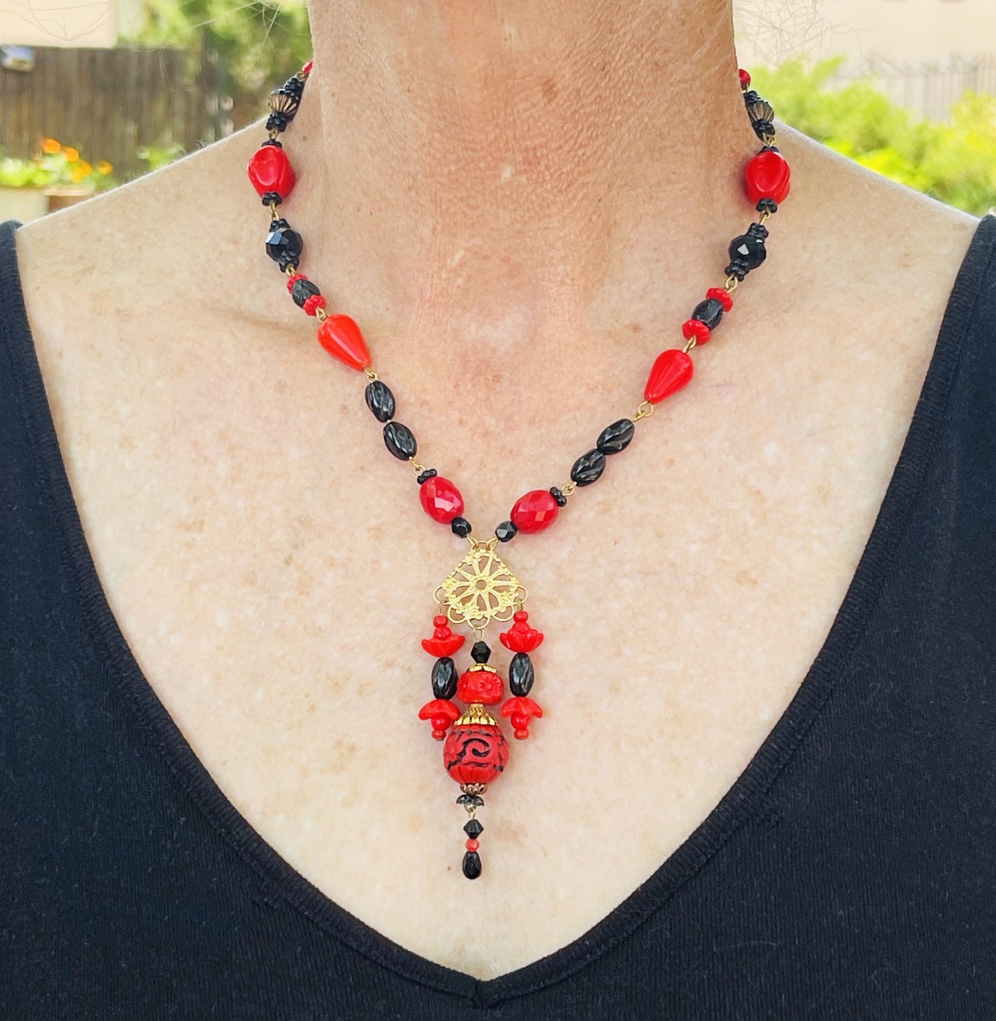 Hand-Made With Vintage Red and Black Beads and a Resin cinnabar drop.